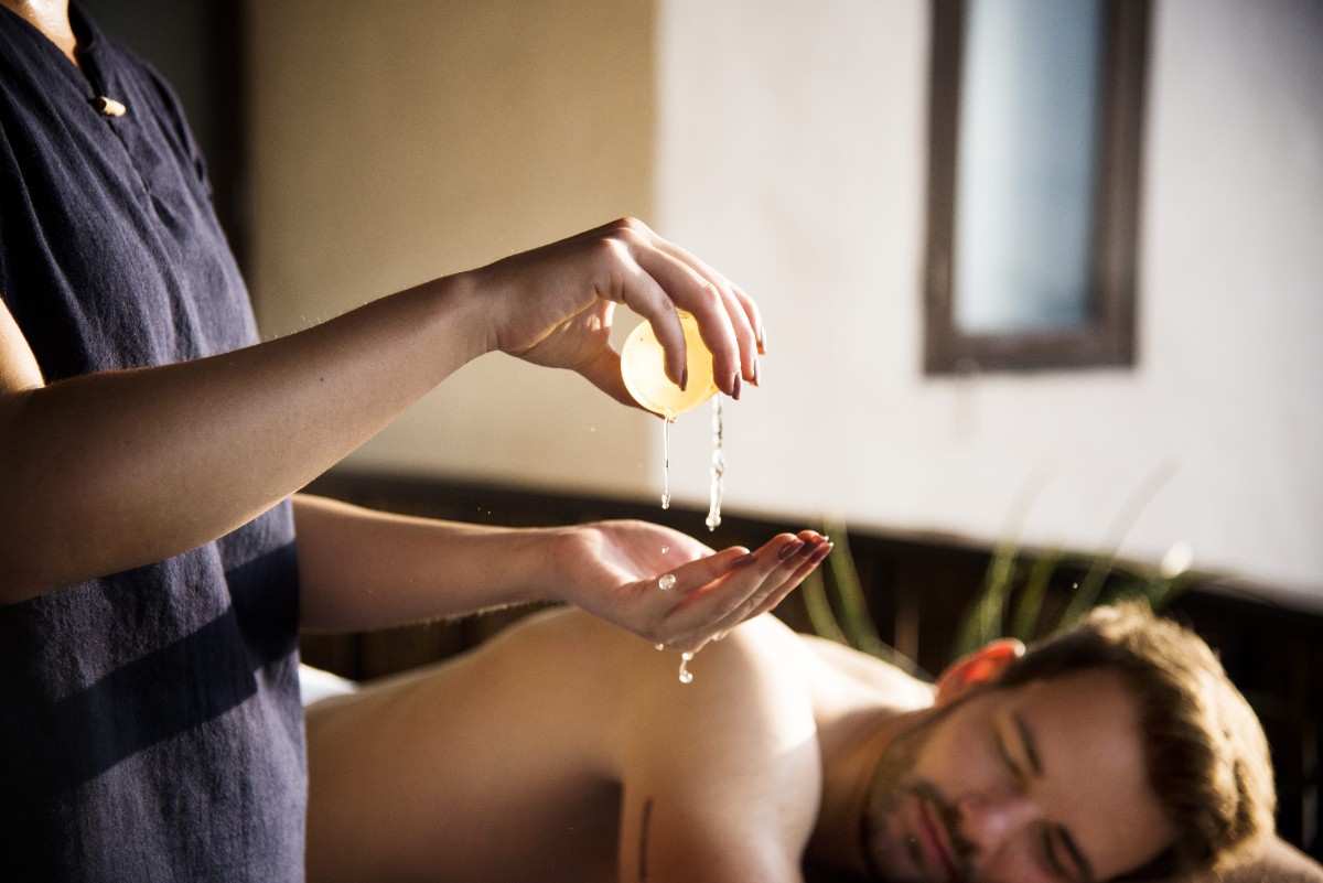 Aromatic oil being applied during massage at spa near Marol